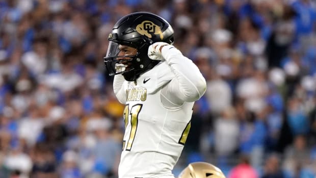 Colorado safety Shilo Sanders celebrates after a hit.